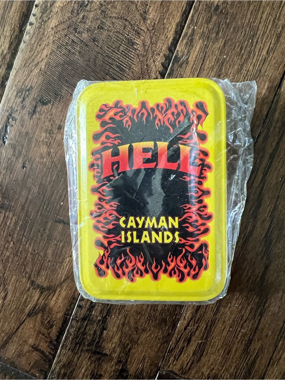 Yellow 'Hell Cayman Islands' deck of cards with Tin.